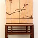 This cabinet with marquetry by Russ Riddle was made from curly maple, African sapele, walnut and African pink ivory wood. (Andy Bronson / The Herald)