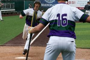 Edmonds-Woodways Sam Alvarado yells as he crosses home plate as teammate Thomas Blahous waits to bat. Arlington Edmonds-Woodway in a 3A baseball district semifinal game held at Everett Memorial Stadium on Tuesday, May 8, 2018 in Everett, Wa. (Andy Bronson / The Herald)
