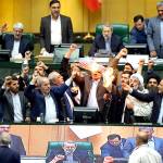 Iranian lawmakers burn two pieces of papers representing the U.S. flag and the nuclear deal as they chant slogans against the U.S. at the parliament in Tehran, Iran, on Wednesday. (AP Photo)