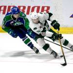 The Silvertips Bryce Kindopp (right) recovers the puck with Swift Currents Artyom Minulin trailing in the first period of Game 4 of the WHL finals on May 9, 2018, at Angel of the Winds Arena in Everett. (Kevin Clark / The Herald)