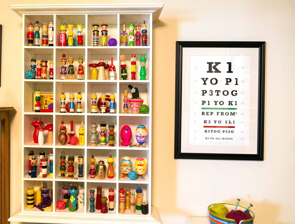 Kim Payne displays knitting spools throughout her knitting room at her home in Everett on May 13, 2018. (Kevin Clark / The Herald)