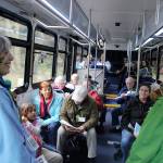 Island Transit, which now operates without collecting fares, may begin to do so. In this photo from April, Langley Whale Center guide Bonnie Gretz visits with people during a whale-themed tour on Whidbey Island. (Patricia Guthrie / South Whidbey Record)