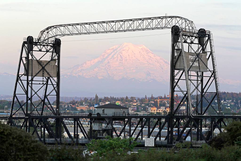 Photos by Ted Warren / Associated Press                                Mount Rainier is seen at dusk and framed by the Murray Morgan Bridge in downtown Tacoma on Monday.