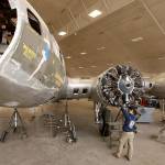 Casey Simmons checks the engine cowl work at the Memphis Belle restoration at the National Museum of the U.S. Air Force in Dayton, Ohio, in 2012. (Ty Greenlees/Dayton Daily News)