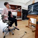 Sue Canterbury, a curator of American art at the Dallas Museum of Art, talks about a painting by Ida OKeeffe titled Spring Lethargy, Texas from 1938, at the DMA in Dallas. (Tony Gutierrez / Associated Press)