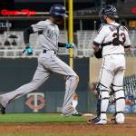 Seattles Dee Gordon (left) scores the only run of the game as Minnesota catcher Mitch Garver looks on in the eighth inning of the Mariners 1-0 win over the Twins on Monday in Minneapolis. (AP Photo/Jim Mone)