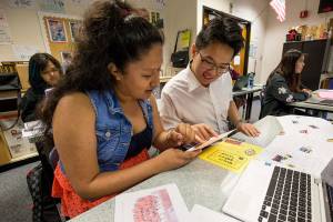 Mariner High School students April Hernandez-Diaz and Brian Pham work through a translation of a card by their pen pals from Japan. Mariner joined the pen pal project 10 years ago with Itoshima High School in Fukuoka, Japan. (Andy Bronson / The Herald)
