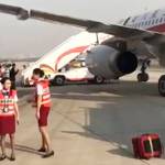 Ground crews are seen Monday near the Sichuan Airline flight that made an emergency landing in Chengdu in southwestern Chinas Sichuan province. (Passenger via AP)