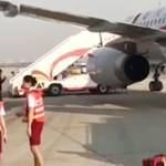 Co-pilot sucked halfway out of plane after windshield cracks