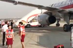 Co-pilot sucked halfway out of plane after windshield cracks