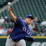 Texas Rangers starting pitcher Bartolo Colon throws against the Seattle Mariners during Mondays game at Safeco Field. (AP Photo/Ted S. Warren)