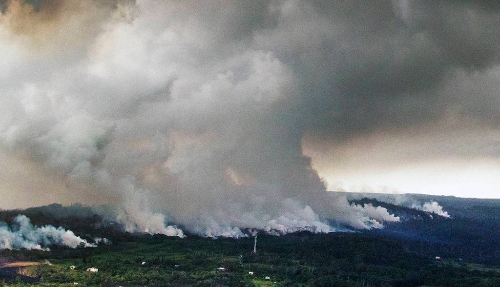 A plume of volcanic steam rises from the alignment of fissures in Hawaiis Kilauea East Rift zone on Wednesday. (Cindy Ellen Russell/Honolulu Star-Advertiser via AP)