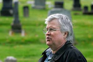 David Dilgard, a longtime historian with the Everett Public Library, speaks to members of the Everett Mayors Youth Council during his guided tour of the Evergreen Cemetery in 2010. Dilgard died Thursday at age 73. (Herald file)