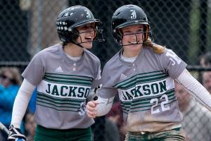 Jacksons Sam Mutolo (left) congratulates Sam Klotters (right) run Thursday afternoon during the 4A District Championship game in Everett on May 17, 2018. Jackson won 2-0. (Kevin Clark / The Herald)