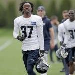 Seattle Seahawks rookie cornerback Tre Flowers (37) runs in from the field, Friday, May 4, after NFL rookie camp in Renton, Wash. The Seahawks announced Flowers signed his rookie contract Thursday. (Ted S. Warren / Associated Press)