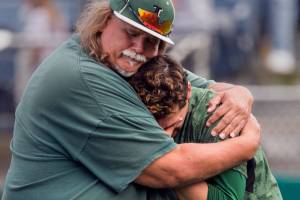 Jackson head coach, Kirk Nicholson comforts Carter Booth after their elimination lose to Skyview Saturday afternoon at Everett Memorial Stadium in Everett on May 19, 2018. Skyview won 2-1 to advance on to state. (Kevin Clark / The Herald)
