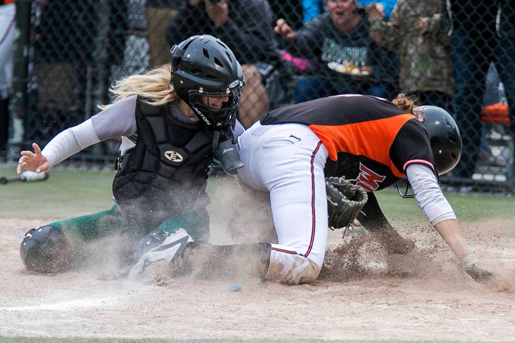 Jacksons Sam Mutolo tags out Monroes Hannah Akin during the 4A District Championship game in Everett on May 17. Jackson won 2-0. (Kevin Clark / The Herald)
