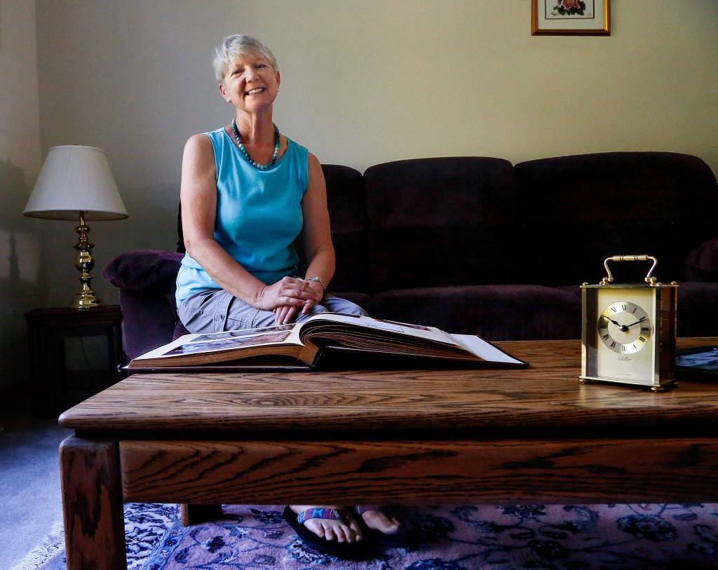 Snohomishs Janette Huskie, who worked two years as a Buckingham Palace housemaid and met the future Princess Diana, gets out her scrapbook of memories and talks about the royal wedding. (Dan Bates / The Herald)