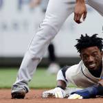 Dee Gordon of the Seattle Mariners loses his helmet on a slide at second base during the first inning of Sundays game at Safeco Field. (AP Photo/Ted S. Warren)