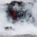Steam rises as lava flows into the ocean near Pahoa, Hawaii, on Sunday. (AP Photo/Jae C. Hong)