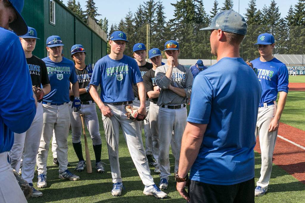 Edmonds Community College assistant baseball coach Paul Gehring (right) addresses the team during a practice on May 16 in Lynnwood. (Kevin Clark / The Herald)