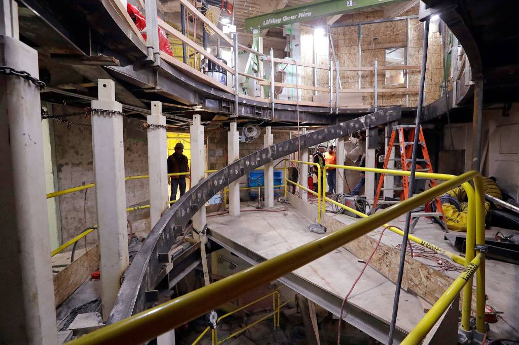 Construction work continues April 18 on a stairwell connecting the viewing level with an area below where glass panels will allow views below in Seattle. (AP Photo/Elaine Thompson)