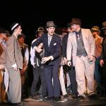 Keaton Markey as Sky Masterson (center), Spencer Langston as Harry the Horse (left) and Thomas Cripe as Benny Southstreet (right) in a scene from Monroe High Schools production of Guys and Dolls. (Photo by Alan Ottini)