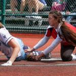 Snohomish pitcher Bailey Greenlee tries to tag Gig Harbors Kaylee Costello at home during a 3A state tournament game on May 25, 2018, at the Regional Athletic Complex in Lacey. Snohomish won 5-3 and later beat Kelso 5-0 to advance to the state semifinals. (Andy Bronson / The Herald)