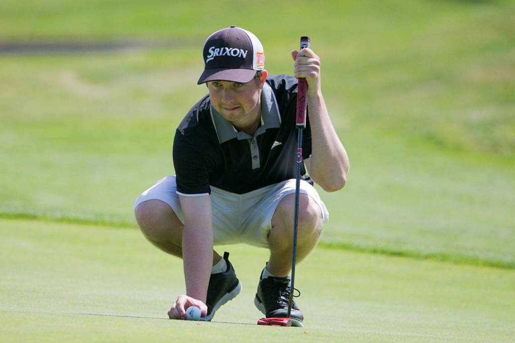 Halen Davis lines up a putt on the second day of the 2018 Snohomish County Amateur golf tournament on May 27, 2018, at Harbour Pointe Golf Course in Mukilteo. (Kevin Clark / The Herald)