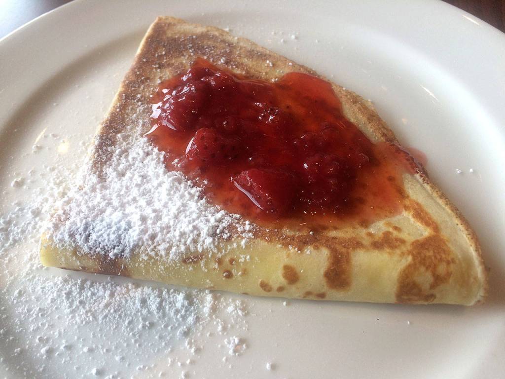 Polska Kuchnias crepes come filled with homemade farmers cheese and topped with powdered sugar and a choice of blueberries, cherries and strawberries. (Evan Thompson / The Herald)