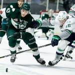 The Silvertips Connor Dewar (left) battles for the puck with Seattles Noah Philp during a playoff game on March 27, 2018, in Kent. (Ian Terry / The Herald)