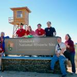Members of the extended Watanabe family gather at the entrance to the Minidoka National Historic Site in southern Idaho. From left are Shizue Watanabe, Bif Brigman, Lucas Watanabe, Hannah Serl, Ben Watanabe, Dale Watanabe, Glen Watanabe, and Jody Serl. (Glen Watanabe)