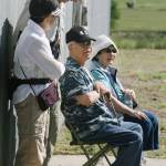 William Watanabe (center) visits with other Japanese Americans and his wife (right), Shizue Watanabe, at the Minidoka National Historic Site in Idaho. William Watanabe died in 2011, after re-visiting the place where his grandparents, parents and four siblings were sent during World War II. (Glen Watanabe)