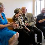 Marilyn Ogden and Kal Leichtman kiss to seal their wedding ceremony with her daughter, Patti Fredley, and his best man, William Brown, on Wednesday at the Snohomish County Courthouse in Everett. (Kevin Clark / The Herald)