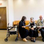 Judge Tam Bui talks with Marilyn Ogden and Kal Leichtman before their wedding ceremony Wednesday at the Snohomish County Courthouse in Everett. (Kevin Clark / The Herald)