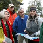 Area residents Joan Smith, (L-R) Gregg Lungren, Mike Gold and Emily Mydynski talk with Todd Zackey over the proposed high density development and the effects on the existing stream and erosion at Picnic Point County Park in Edmonds on Nov. 6, 2015. (Kevin Clark / Herald file)