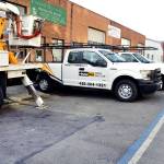 Aalbu Brothers and Everett Hydraulics in the 2900 block of Grand Avenue have reserved parking marked on the street with blue paint. (Sue Misao / Everett Herald)