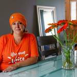 Judy Schneider-Wallace lost her first husband to suicide by gun. She is part of the Mukilteo/Lynnwood Moms Demand Action for Gun Sense in America group that will fly a large orange flag in Mukilteo through June 11, and who demonstrated Friday at an I-5 overpass and the Mukilteo Speedway in support of the Wear Orange movement to bring awareness to gun violence. (Dan Bates / The Herald)