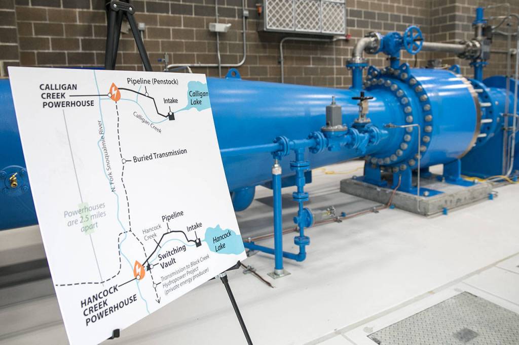 The large blue pipes carry the water to the turbine inside the Calligan Creek Hydro Project powerhouse in King County. (Lizz Giordano / The Herald)