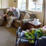 Katie Gaswint visits with clients of the daycare in the TV area. (Steven Powell / Marysville Globe)