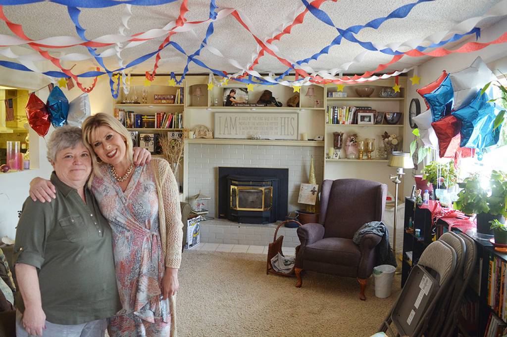 Business partners Katie Gaswint and Amy Marohn like to decorate the living room in happy, festive colors. (Steven Powell / Marysville Globe)