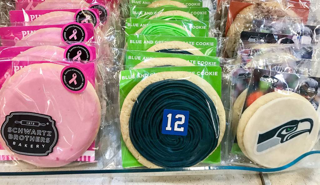 Seahawks and other frosted cookies by Schwartz Brothers Bakery​ are among the many Washington products sold on the ferries.​ (Andrea Brown / Herald file)