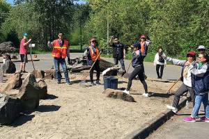 Volunteers from near and far spruce up park