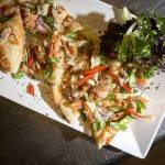 Smoked salmon and asparagus flatbread are made with red pepper and onion and placed on a creme fraiche base. (Ian Terry / The Herald)