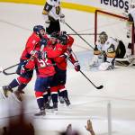 Teammates celebrate with Washingtons T.J. Oshie (center of the huddle), who lived in Everett and Stanwood as a youngster, after he scored a goal in the Capitals 6-2 win over Vegas in Game 4 of the Stanley Cup Final on Monday in Washington. (AP Photo/Pablo Martinez Monsivais)