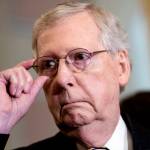 Senate Majority Leader Mitch McConnell, R-Ky., tells reporters he intends to cancel the traditional August recess and keep the Senate in session to deal with backlogged tasks, on Capitol Hill in Washington, on Tuesday. (AP Photo/J. Scott Applewhite)