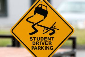 Drivers eduction class parking sign at Arlington High School in Arlington on June 8, 2018. (Kevin Clark / The Herald)