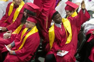 Students reacts to family and friends during the Marysville-Pilchuck High School Class of 2018 Commencement at Angel of the Winds Arena Wednesday night in Everett on June 13, 2018. (Kevin Clark / The Herald)