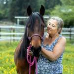 Volunteer Lillian Hinett with SAFE horse Stella, a Paso Fino cross and one of her favorite horses to care for at the Redmond nonprofit. (Photo by Jessica Farren)