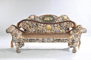 Antique sofa is completely covered with shells — not fabric